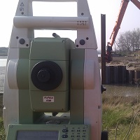 total station theodolite aligning sheet pile installation